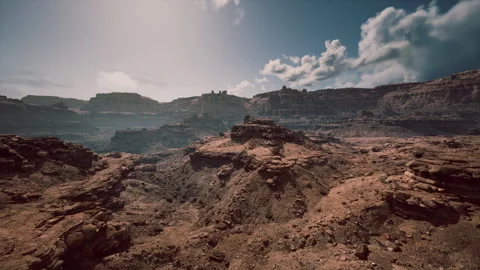 Stunning rocky landscape with distant cliffs and dramatic cloud formations Stock Footage 317958754