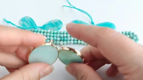 Stunning round turquoise gemstone pendants featuring gold bezel settings Stock Footage 345139577