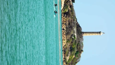 Stunning scene of Ke ga lighthouse, coracle boats in foreground, Vietnam. Stock-Footage 200094282