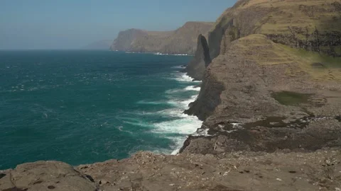 Stunning Scenery Of Geitaskoradrangur Sea stack at Leitisvatn and Video stock 194435176