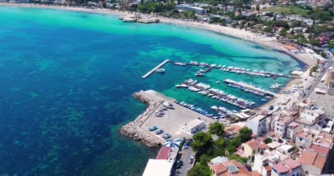 Stunning Seaside View of Bustling Harbor and Beach at a Coastal Town on a Sunny Stock-Footage 316166801
