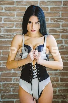 Stunning sexuality. Passionate mysterious lover. Enjoying morning sunlight Stock Photos