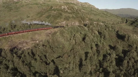 Stunning shot of the Jacobite Steam Train going over the Glenfinnan viaduct Stock Footage 60012062