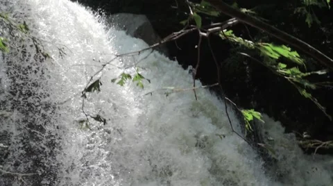 STUNNING SLOW MOTION WATERFALL PAN IN SUNLIGHT Stock Footage 66689504