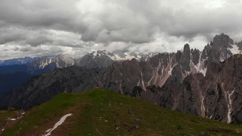 Stunning snow capped dolomites alps italy austria by drone Stock Footage 126462853