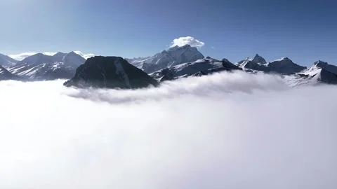 Stunning Snow Capped Mountains Emerging From a Sea of Clouds Tibet China Stock Footage 339311129