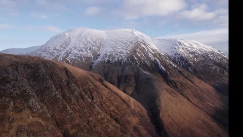 Stunning SnowCapped Mountain Range Found in Scotland is a Sight to Behold Stock Footage 320799347
