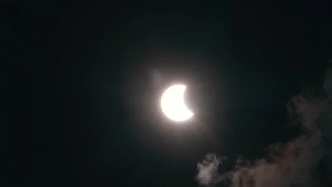 Stunning solar eclipse reveals moon as clouds slowly clear away Stock Footage 321458061
