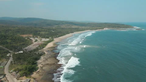 Stunning South Java Beach With Rolling Blue Waves Near Bajah Township In Stock Footage 289319116