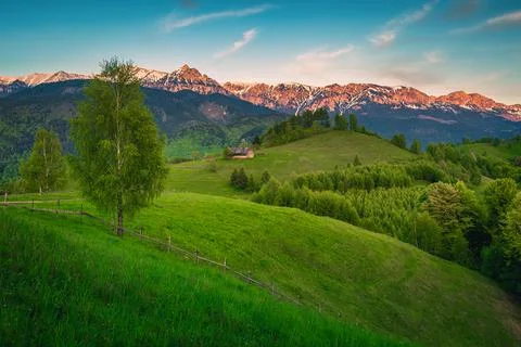 Stunning spring alpine landscape at sunset, Moieciu de Sus, Romania Stock Photos