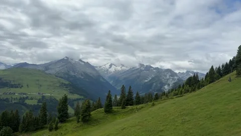 Stunning Summer View of the Austrian Alps with Green Slopes and Majestic Sa.. Stock Footage 332713761