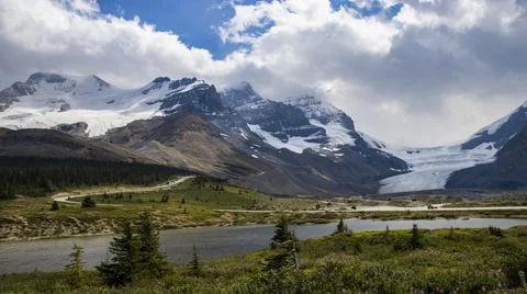 Stunning sun rays shining on the peaks and glaciers Stock Photos