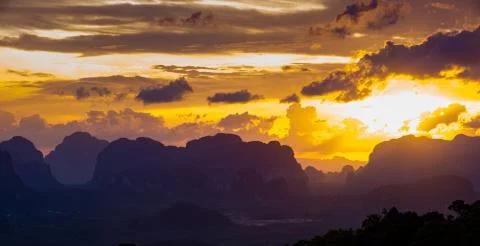 Stunning sunset behind limestone mountains. View from the Tiger Cave Temple ( Stock Photos