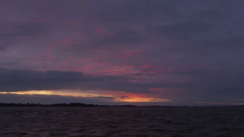 Stunning sunset from a boat on the Atlantic Ocean, in Brittany, France Stock Footage 229731987