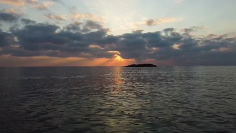 Stunning sunset breaking through the clouds over the sea Stock Footage 167930988