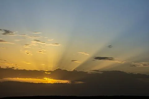Stunning sunset casts vibrant rays across the sky creating a breathtaking v.. Stock Photos