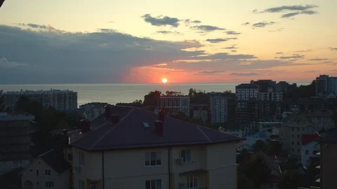 Stunning sunset in the city of sochi. window view between houses Stock Footage 115543402