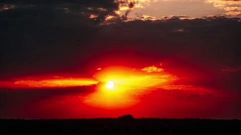 Stunning sunset with dramatic red and orange sky over horizon Stock Footage 286753302
