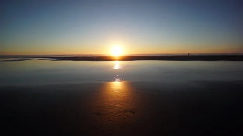 Stunning Sunset with footprints in the sand Stock Footage 57367904