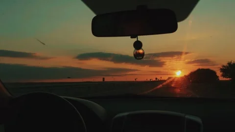 Stunning sunset on horizon through windshield of car. Travel concept 库存影片 247329813
