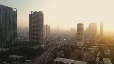 A stunning sunset over Bangkok's skyline with skyscrapers and bustling city life Stock Footage 304242593
