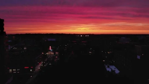 Stunning sunset over city skyline, vibrant twilight colors painting the sky.. Stock Footage 337404993