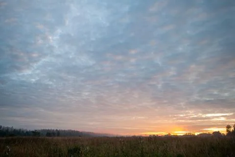 Stunning Sunset over Fields Stock Photos