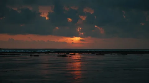 Stunning sunset over ocean waves with dramatic clouds Stock Footage 303394665