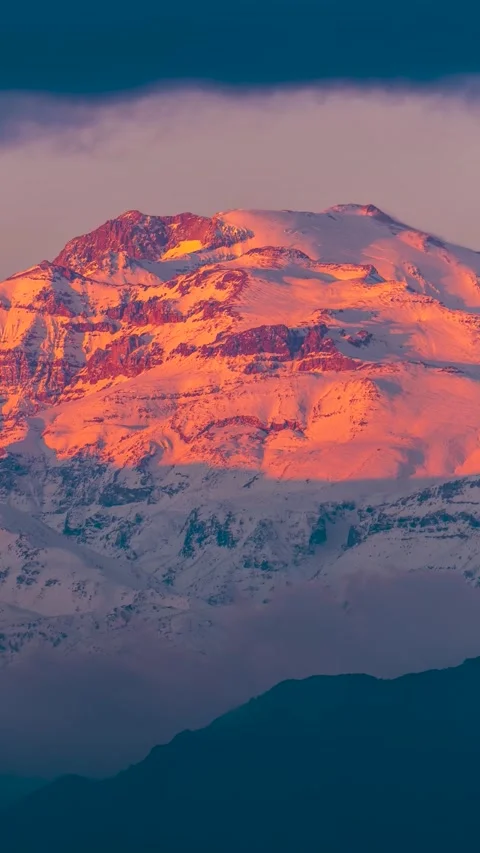 Stunning Sunset over Snow Capped Cerro del Plomo Mountain Peak in Andes Range Stock Footage 334217388