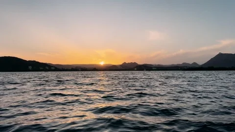 Stunning Sunset Over Tranquil Waters: A Majestic View of Nature's Beauty in Sere Stock-Footage 336602502