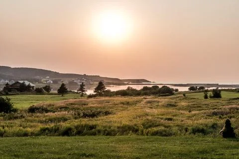 Stunning Sunset panoramic view of the Cape Breton Island Coast line cliff sce Stock Photos