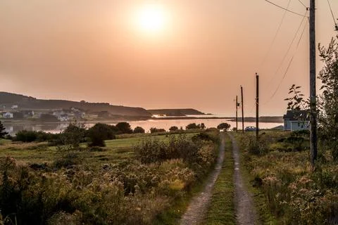 Stunning Sunset panoramic view of the Cape Breton Island Coast line cliff sce Stock Photos