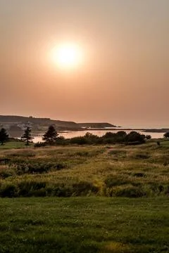 Stunning Sunset panoramic view of the Cape Breton Island Coast line cliff sce Stock Photos