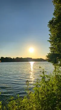 A Stunning Sunset Reflection Over the Calm Waters Creates an Atmosphere of Peace Stock Photos