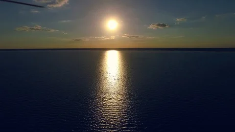 Stunning sunset. Reflection of sunlights on lake. Clear water. Drone footage Video stock 105253448
