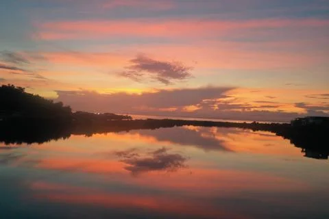 Stunning Sunset Sky Reflected in Calm River, Coastal China Stock Photos