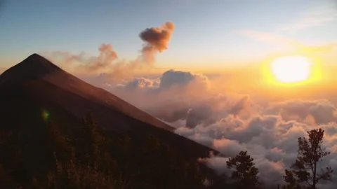 Stunning sunset view of an active volcanic eruption with clouds above mount.. Stock Footage 337806010