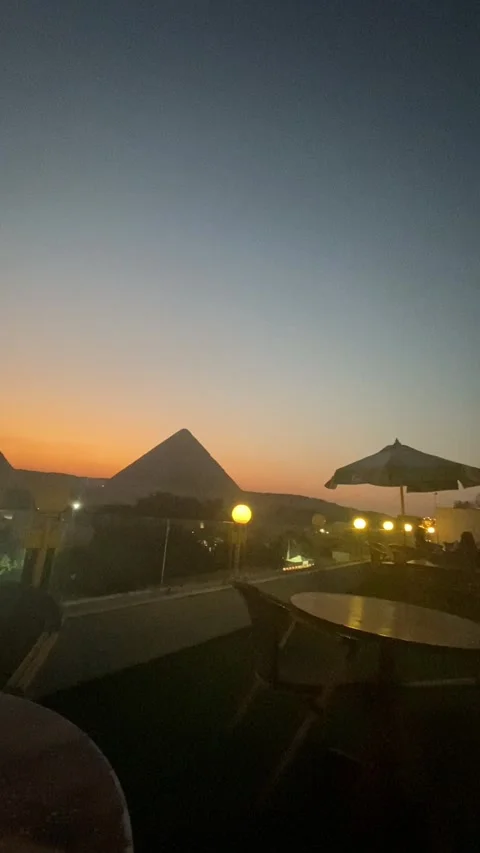 Stunning Sunset View of the Great Pyramid of Giza from a Rooftop Terrace in Giza Stock Footage 323159028