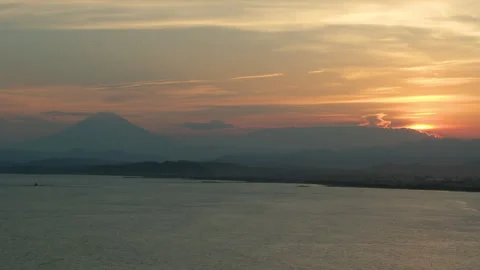 Stunning Sunset View of Mount Fuji from the Kamakura Coastline in Japan. Stock Footage 337691870