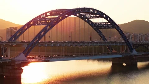 Stunning sunset view over bridge and river with mountains in the background Video stock 310118113