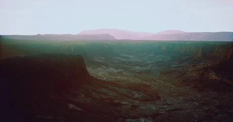 Stunning sunset view over a vast canyon landscape in a remote location 스톡 일러스트