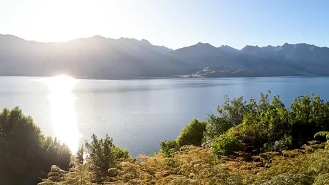 Stunning Sunset Views of Lake Hawea: A Serene Alpine Lake Surrounded by Sou.. Stock Footage 295011981