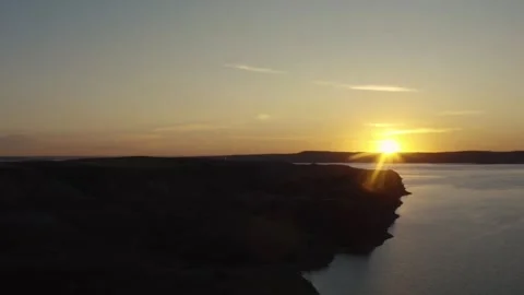 Stunning sunset views over the calm waters at the lake shore Stock Footage 320266971