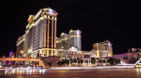 Stunning time lapse of Caersar's Palace casino Las Vegas at night Stock Footage 33871393