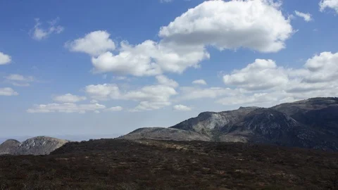 Stunning time-lapse of clouds over mountains Stock Footage 115576959