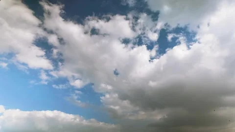 Stunning Time Lapse of Fluffy White Clouds Drifting Across a Clear Blue Sky Stock Footage 336658878