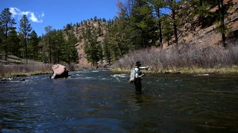 Stunning Time Lapse of Man Fly Fishing in The Colorado River Video stock 136076511