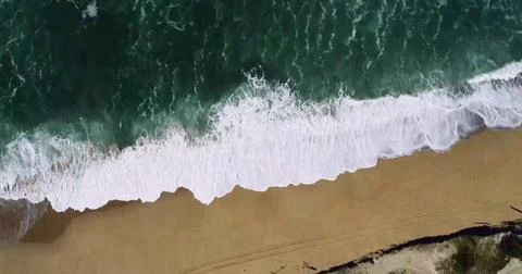 Stunning Top-Down View of Ocean Waves Breaking on a Sandy Beach Stock Photos