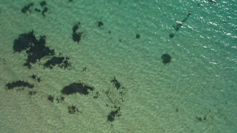 Stunning top down view of tropical ocean, passing over junk boat Stock Footage 119970760