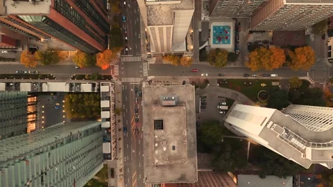 Stunning top drone view in warm colours of building rooftops, modern downtown  Video stock 320532145